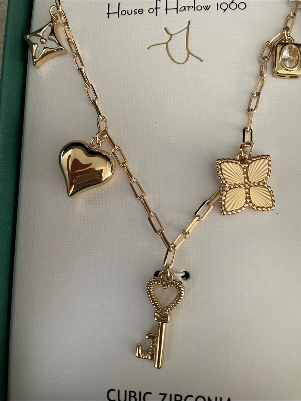 House of Harlow 1960 Gold Charm Necklace with Heart Key and Floral Pendants